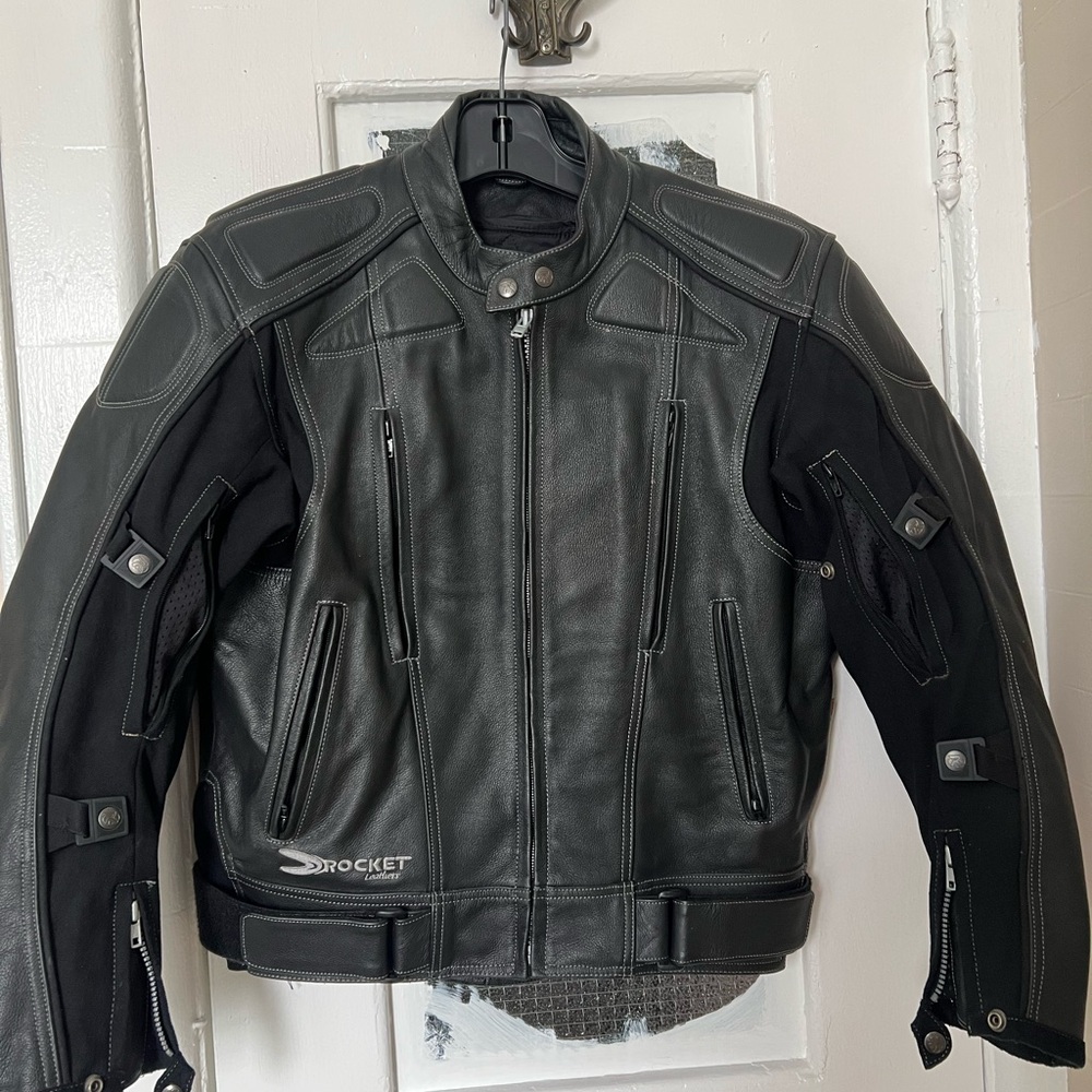 Excellent condition. It’s a tight XL. No rips holes or tears.